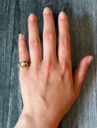 Figural Ring of Mermaids or Women Holding a Pearl in 14K Gold
