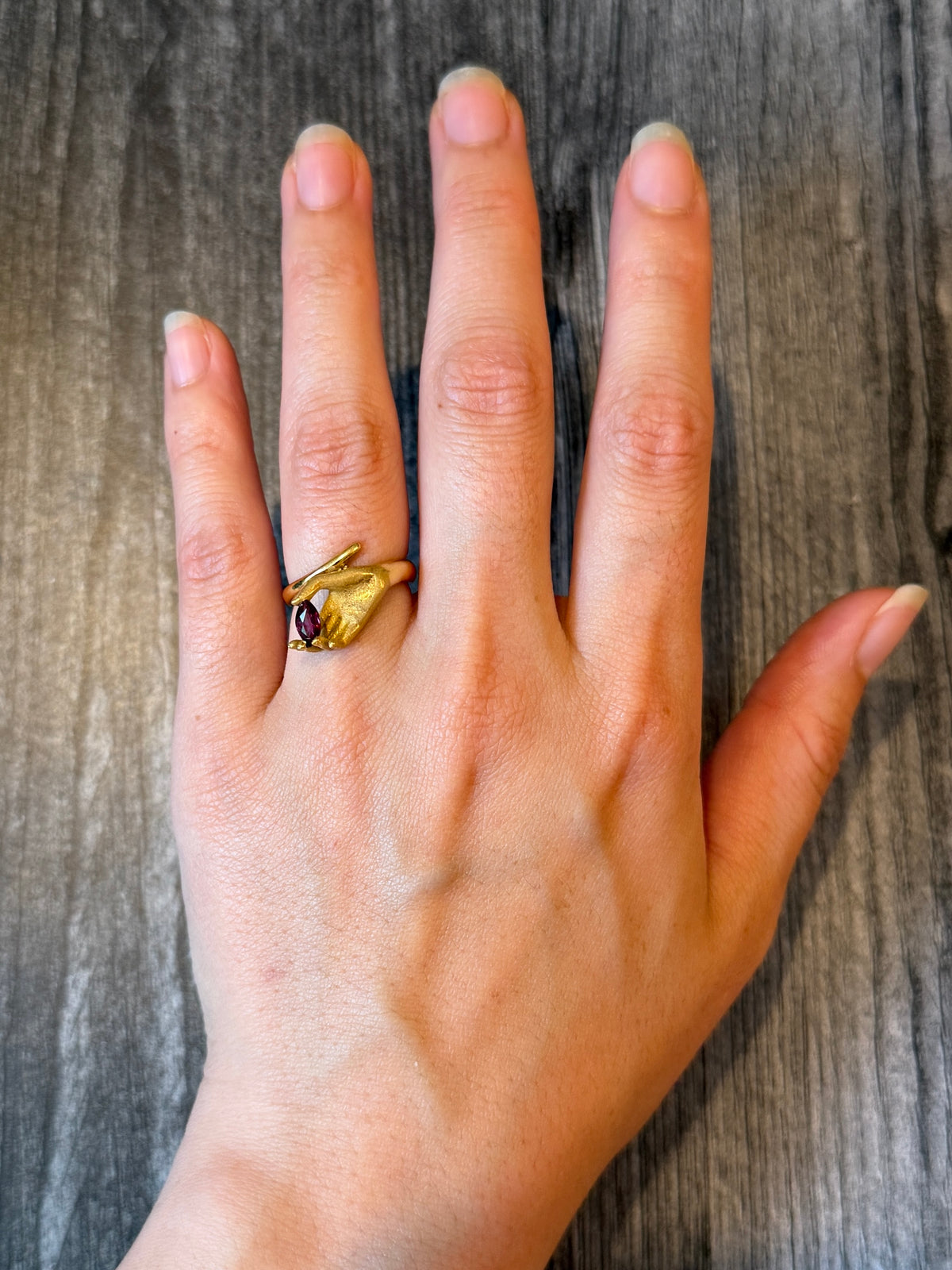 Figural Hand Holding a Ruby Ring in 18K Gold, Size 6.5 (I)