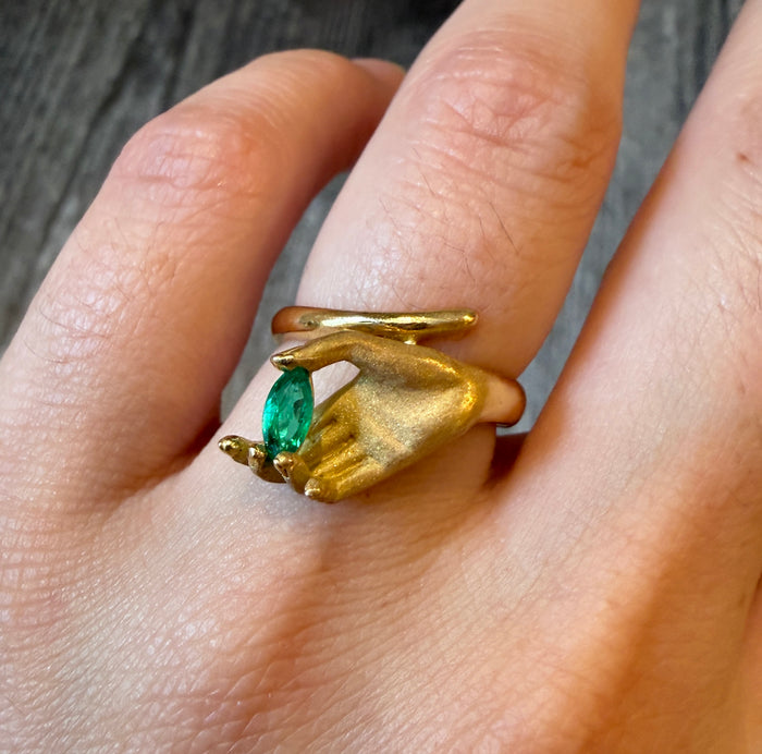 Figural Ring of Hand Holding an Emerald in 18K Gold(I)