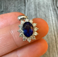 Natural Sapphire and Diamond Halo Pendant in 18K Gold