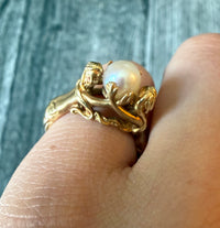 Figural Ring of Mermaids or Women Holding a Pearl in 14K Gold