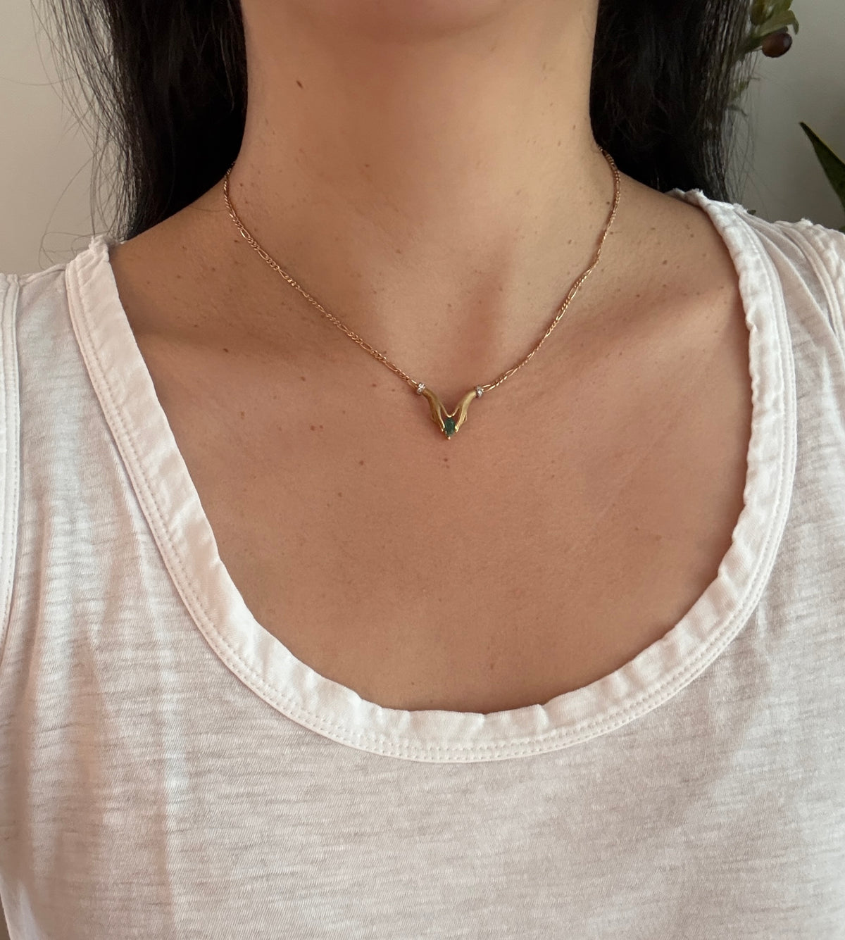 Two Hands Holding an Emerald Necklace in 18K Gold with Diamond Cuffs (I)