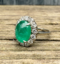 3.3 Carat Cabochon Emerald and Diamond Halo Ring