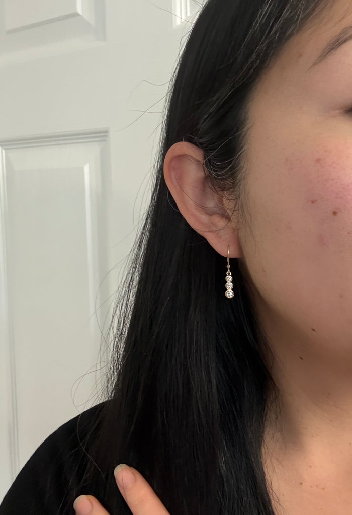 Bezel Set Triple Diamond Dangle Earrings in 14K Gold